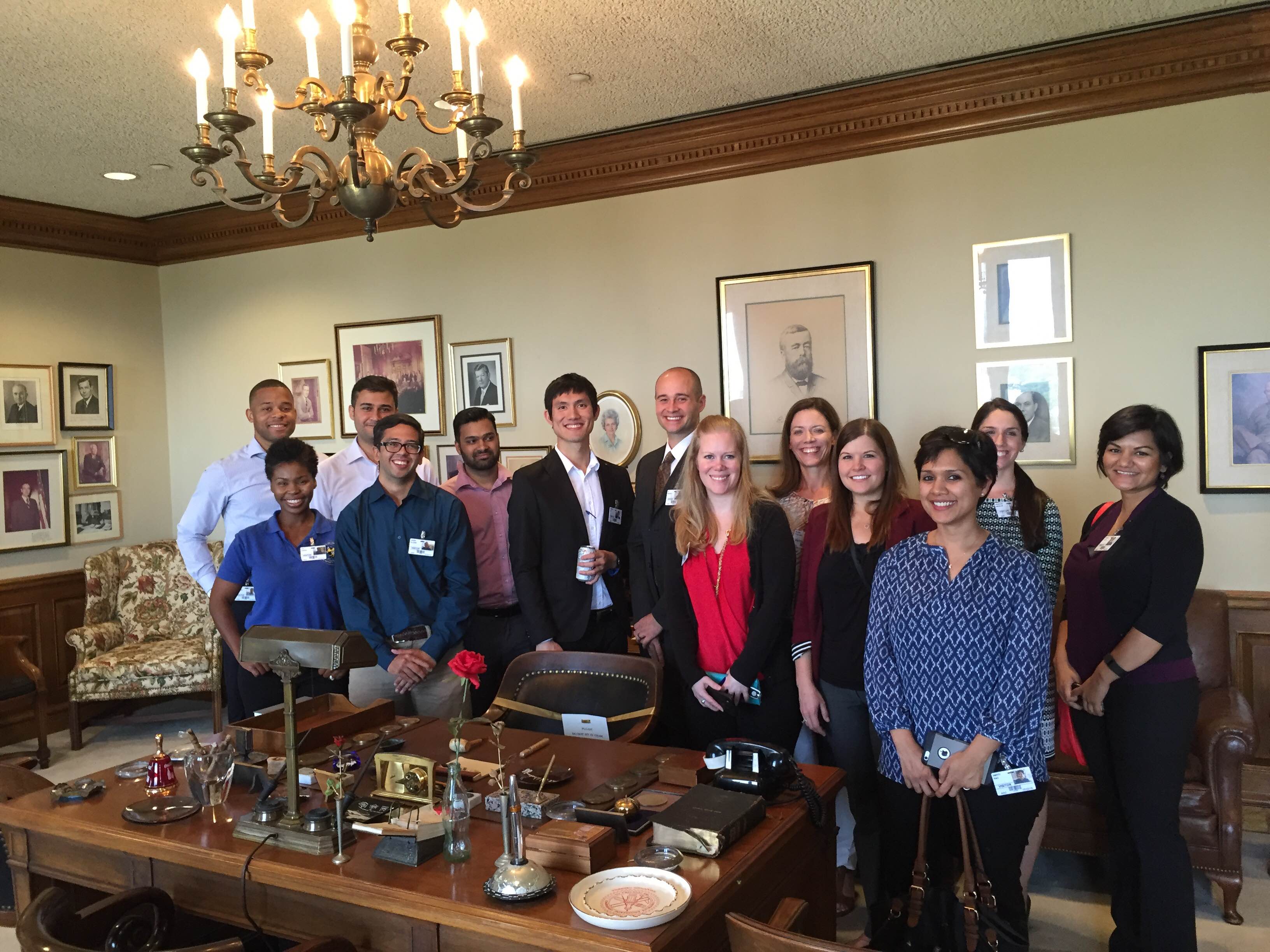  Georgia Tech MBA Net Impact chapter members in Robert W. Woodruff's office at Coca-Cola